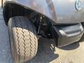 A 2017 Yamaha Golf Cart G29 E displaying its front tire and suspension system with a close-up view of the tire tread pattern and wheel assembly