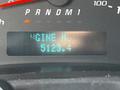 The display panel of a 2013 Chevrolet Express showing the engine hours as 5123.4