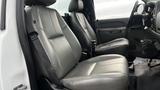 Interior view of a 2013 Chevrolet Silverado 1500 showing driver and passenger seats with grey leather upholstery