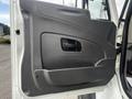 The image shows the interior door panel of a 2008 International 7500 featuring a black plastic handle and a textured surface