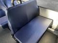 A blue upholstered seat from a 2018 Chevrolet Express with a textured fabric surface designed for passenger comfort