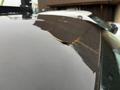 A 2011 GMC Sierra 3500HD with a visible crack on the roof surface