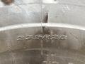 Close-up of the tire tread of a 2018 Doosan DL300-5 showing the size designation 23.5R25 embossed on the rubber surface