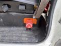 A red switch labeled Off and On mounted on a black surface inside a 2012 Chevrolet Express vehicle