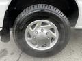 A close-up of a silver alloy wheel mounted on a black tire labeled Agilis CrossClimate with a visible tread pattern