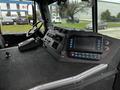 The interior dashboard of a 2009 Spartan Gladiator featuring control panels buttons and a display screen