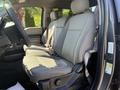 Interior of a 2018 Ford F-150 showing the front passenger and driver seats with gray upholstery and a steering wheel