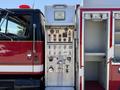 A 1991 International 4600 fire truck with a control panel featuring various gauges buttons and switches for operation