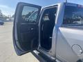 A 2021 RAM 1500 with the driver's side door open showcasing the interior space and seating arrangements