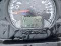 Close-up of a 2017 Polaris Scrambler gauge displaying speed and other metrics with a water-streaked surface