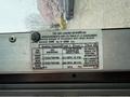 Tire and loading information label on a 2012 Ford Econoline detailing tire sizes and pressure recommendations for safe operation