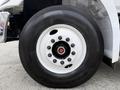 Close-up of a wheel from a 2017 Hino 338 featuring a white rim and black tire with the brand Hankook visible on the sidewall