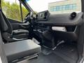 2023 Mercedes-Benz Sprinter interior featuring driver and passenger seats dashboard and center console with controls and storage compartments