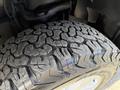 Close-up of a heavily treaded tire from a 2018 Ford F-150 showcasing rugged patterns and wear on the surface