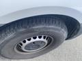 Close-up of the front tire of a 2022 Mercedes-Benz Sprinter showing the rim and tread pattern