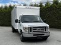 A 2018 Ford Econoline with a box truck design featuring a white exterior and a front grill with the Ford emblem