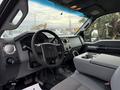 Interior view of a 2013 Ford F-350 SD showcasing the steering wheel dashboard and center console