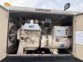 A 2005 Katolight SED60FPJ4 generator with a large engine, control panel and exhaust components visible inside a metal enclosure