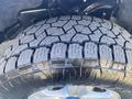 Close-up of a rugged tread tire on a 2019 Ford F-150 showcasing its deep grooves and sturdy design