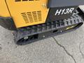 A close-up view of a yellow 2024 AGT Industrial H13R Mini Excavator showcasing its tracked undercarriage and detailed design elements