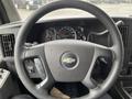 Steering wheel of a 2012 Chevrolet Express featuring a Chevrolet logo and control buttons on the side