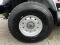 Close-up of a tire mounted on a 2008 International 7500 truck showcasing a Michelin brand with size 445/65 R 22.5