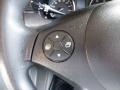 Close-up of a steering wheel control button featuring directional arrows for adjusting settings in a 2016 Mercedes-Benz Sprinter