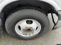 A close-up view of the wheel and tire of a 2018 Chevrolet Express showcasing the tread pattern and lug nut design