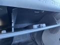 Interior view of a 2016 Ford F-250 SD glove compartment showing an open space for storage with a latch mechanism visible