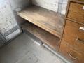 Interior view of a 2007 Morgan Olson Workhorse W42 with a wooden shelf and a set of wooden drawers on the side