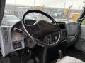Interior view of a 2006 International 4200 truck's dashboard and steering wheel with various controls and instruments visible