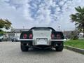 A rear view of a 1972 Chevrolet Corvette showcasing its distinctive tail lights and sporty design