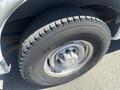A close-up of a 2007 Chevrolet Express tire showing detailed tread pattern and the Bridgestone logo on the sidewall