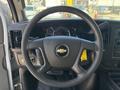 Steering wheel and dashboard of a 2020 Chevrolet Express with speedometer and controls visible