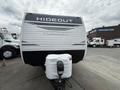 A 2022 Keystone Hideout RDWE 20RDWE travel trailer displaying a sleek exterior design with the word "HIDEOUT" prominently featured on the front