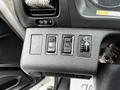 Control panel with buttons for setting functions like cruise control and a knob for adjusting settings in a 2020 Hino 338