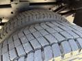 Close-up of a tire from a 2023 Ford F-550 showing detailed tread patterns and sidewall design