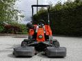 A 2015 Jacobsen Eclipse golf course mower with a red and black body showcasing its cutting reels and steering wheel