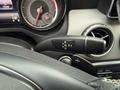 Close-up of the gear shift lever in a 2016 Mercedes-Benz GLA-250 showing drive settings R N D P along with a circular air vent and part of the dashboard