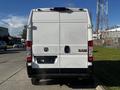 White 2021 RAM Promaster van viewed from the rear with a simple design and no visible windows on the back doors