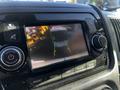 A rearview camera display showing the back of a 2021 RAM Promaster with guidelines for parking assistance