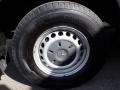 A close-up view of a tire and wheel of a 2016 Mercedes-Benz Sprinter featuring a silver wheel rim and a black tire with visible tread patterns