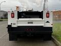 A 2019 Ford F-550 truck with a black and white exterior and a Knapheide flatbed in the rear