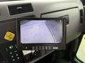 A monitor displaying a rearview camera feed in a 2016 Peterbilt 348 cab