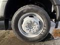 A close-up of the wheel of a 2019 Ford F-550 showcasing a silver rim with multiple lug nuts and a black tire with a tread pattern