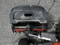 2015 Jacobsen Eclipse with a black hood and visible mechanical components including a cutting mechanism and handlebar attached to the front