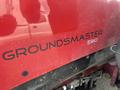 A red Toro Groundmaster 5910 with the model name Groundmaster 5910 prominently displayed on the side in black lettering