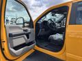 Interior view of a 2017 Ford F-250 SD with an open driver's door showing the dashboard steering wheel and seats