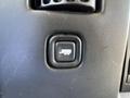 Button for power door lock on a 2014 Chevrolet Express interior panel