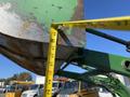 A 2008 John Deere 3320 300X tractor bucket with a measuring tape indicating a measurement along its edge